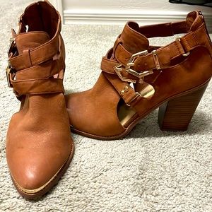 Leather upper fabric lining ankle boots with beautiful gold adjustable buckles.